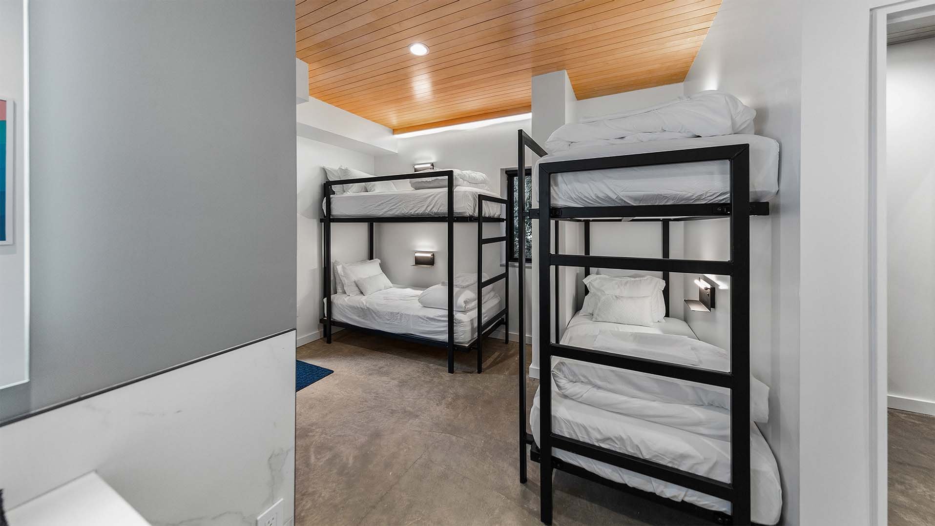 RAVN HAUS vacation rental Elevate Bunk Room custom black metal twin and twin-XL bunks with heated floors on Mt. Hood, Oregon.