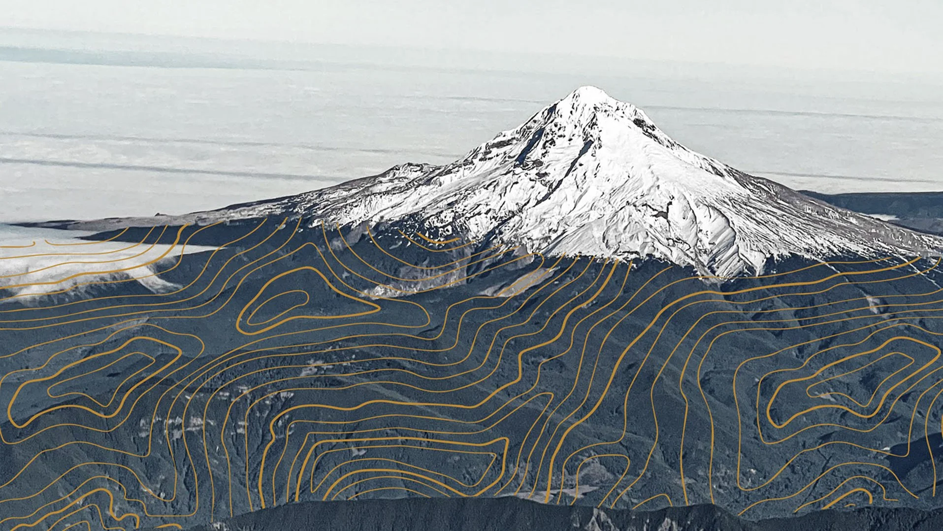 Aerial view of snow-capped Mt. Hood overlaid with topographic map lines in a circular crop — the iconic peak that surrounds RAVN HAUS in Government Camp, Oregon