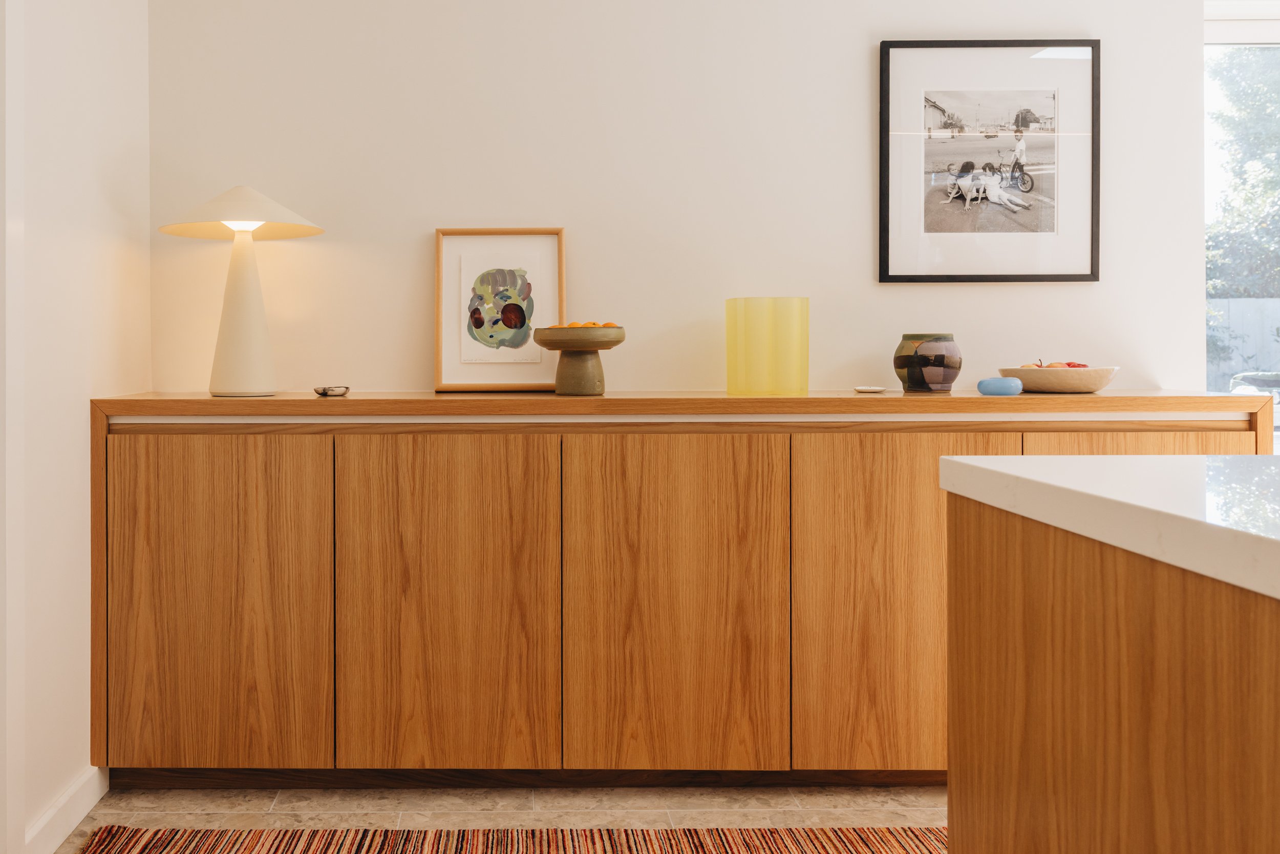 Warm family kitchen design NZ  with design storage - Honour Creative.