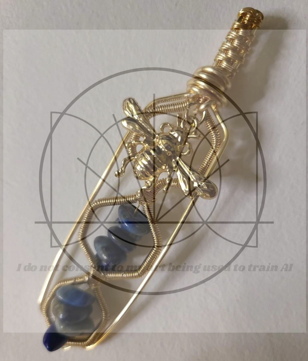 "Bee Cartouche"

Brass, lapis lazuli (sold)