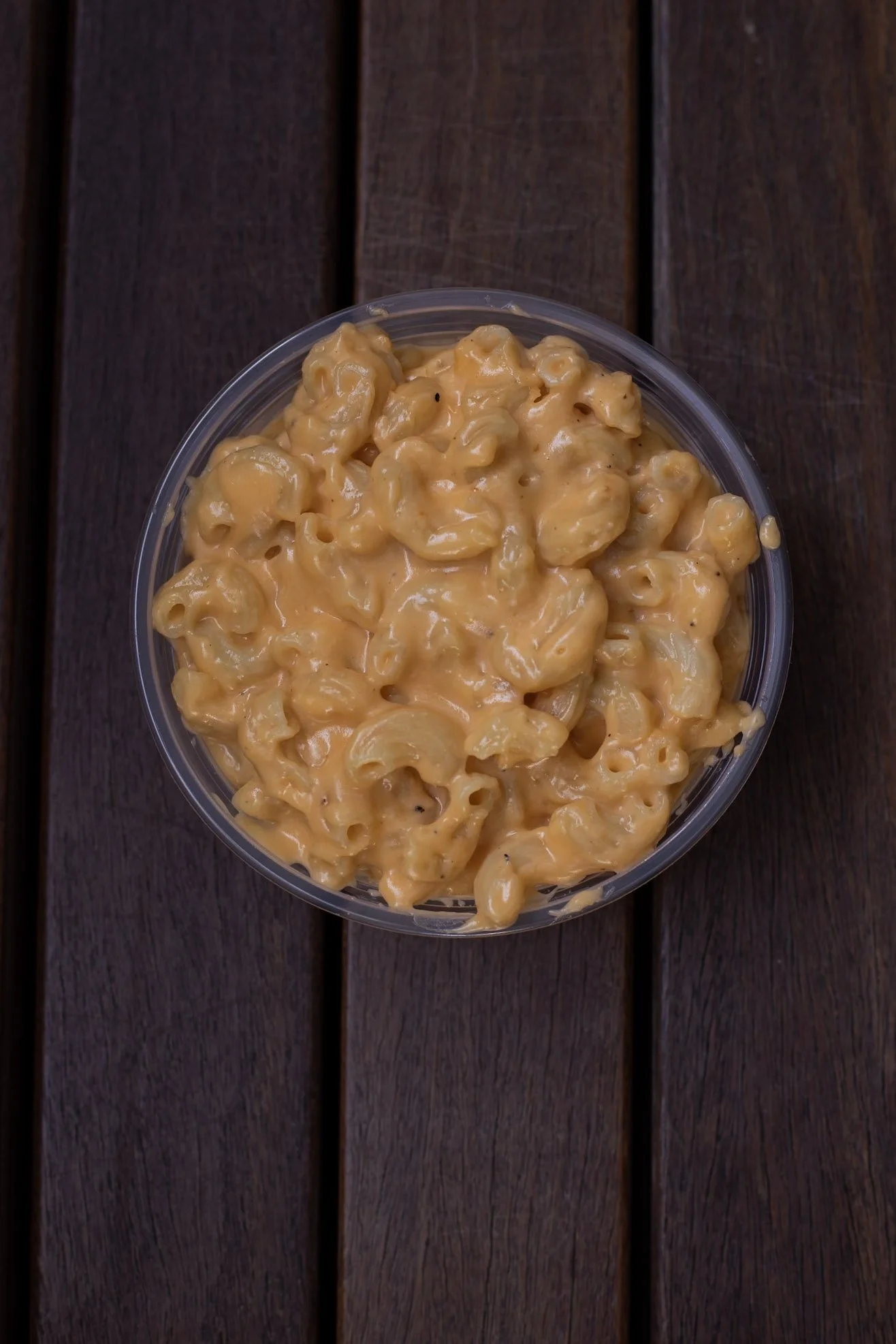 Round container with Mac and Cheese.