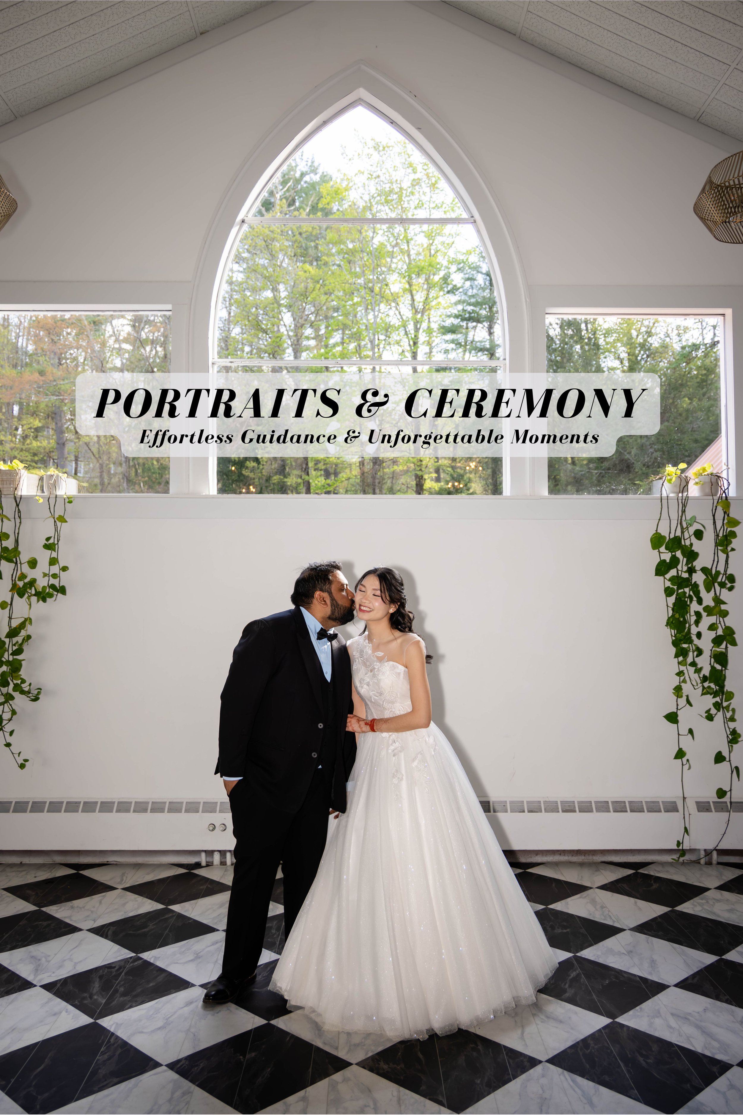 A bride and groom sharing a kiss in a bright room with large arched window and black-and-white checkered floor.