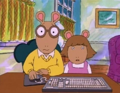 Arthur and DW from the show Arthur, sitting together in their home at a computer looking scared