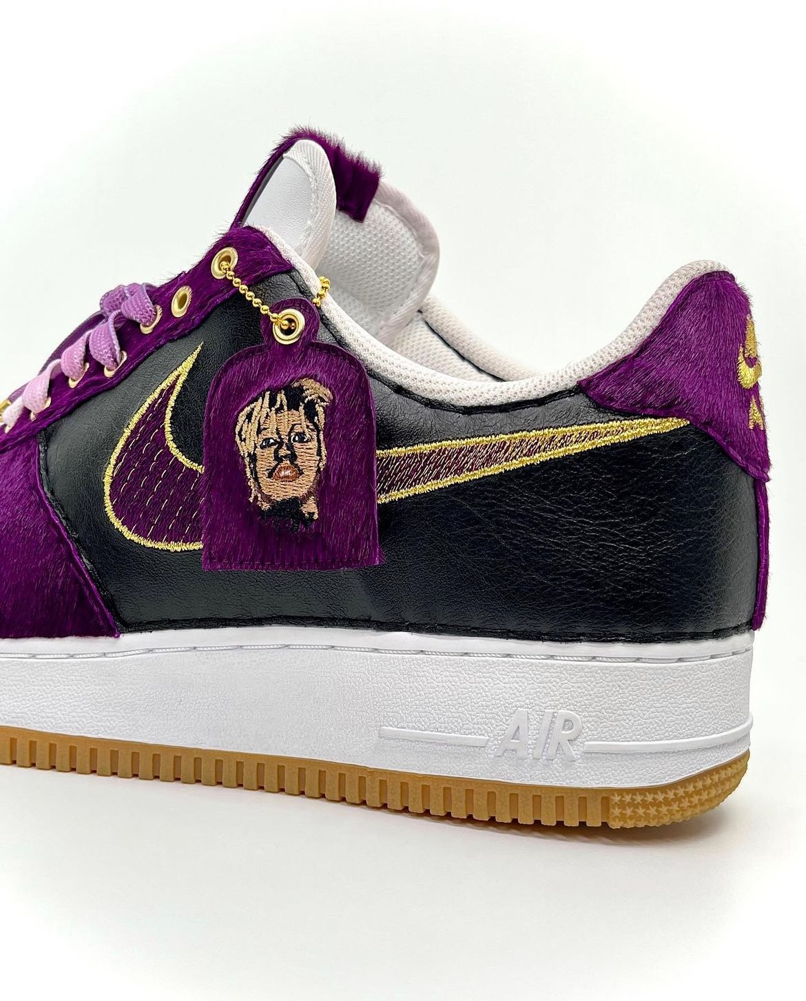 "WRLD Renowned" Nike Air Force 1 featuring a stitched gradient swoosh. Custom Photostitch embroidery of Juice WRLD on hang tag. Leathers used: Black Amalfi Lambskin, Violet Pony.