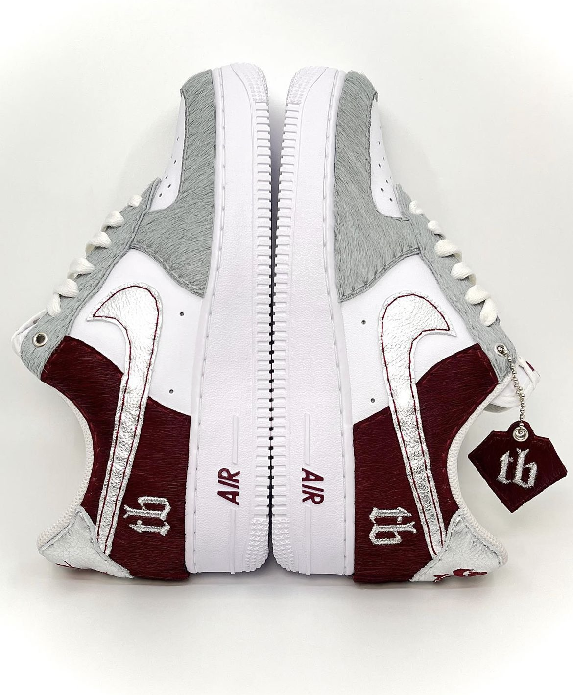 "Sublime" Nike Air Force 1 featuring custom logo embroidery on heels and manually cut hang tag. Leathers used: Grey Pony, Maroon Pony, Silver Metallic Tumbled