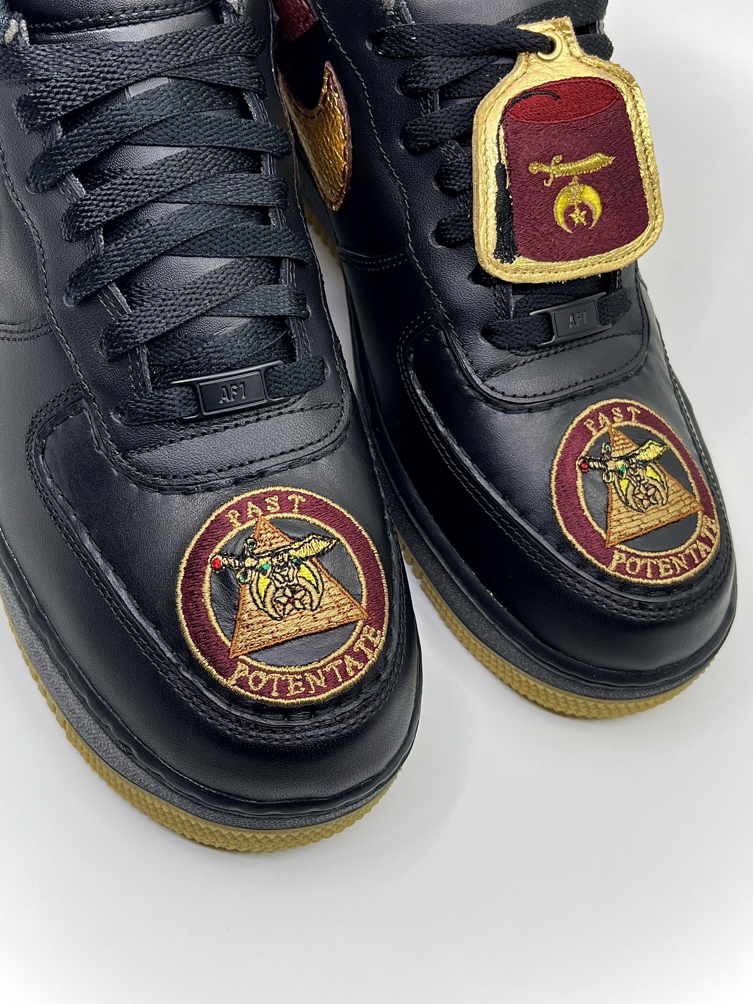 "Past Potentate" Nike Air Force 1 - Custom embroidery on toe box and custom embroidered hang tag. Leathers used: Black Amalfi Lambskin, Gold Metallic Tumbled.