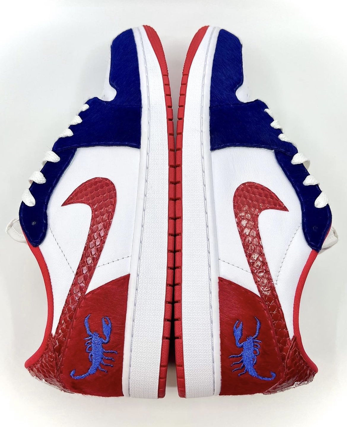 "Buffalo Soldiers" Air Jordan 1 Low OG for Griselda Records. Leather used: Red Pony, Zaffre Pony, Ruby Python.