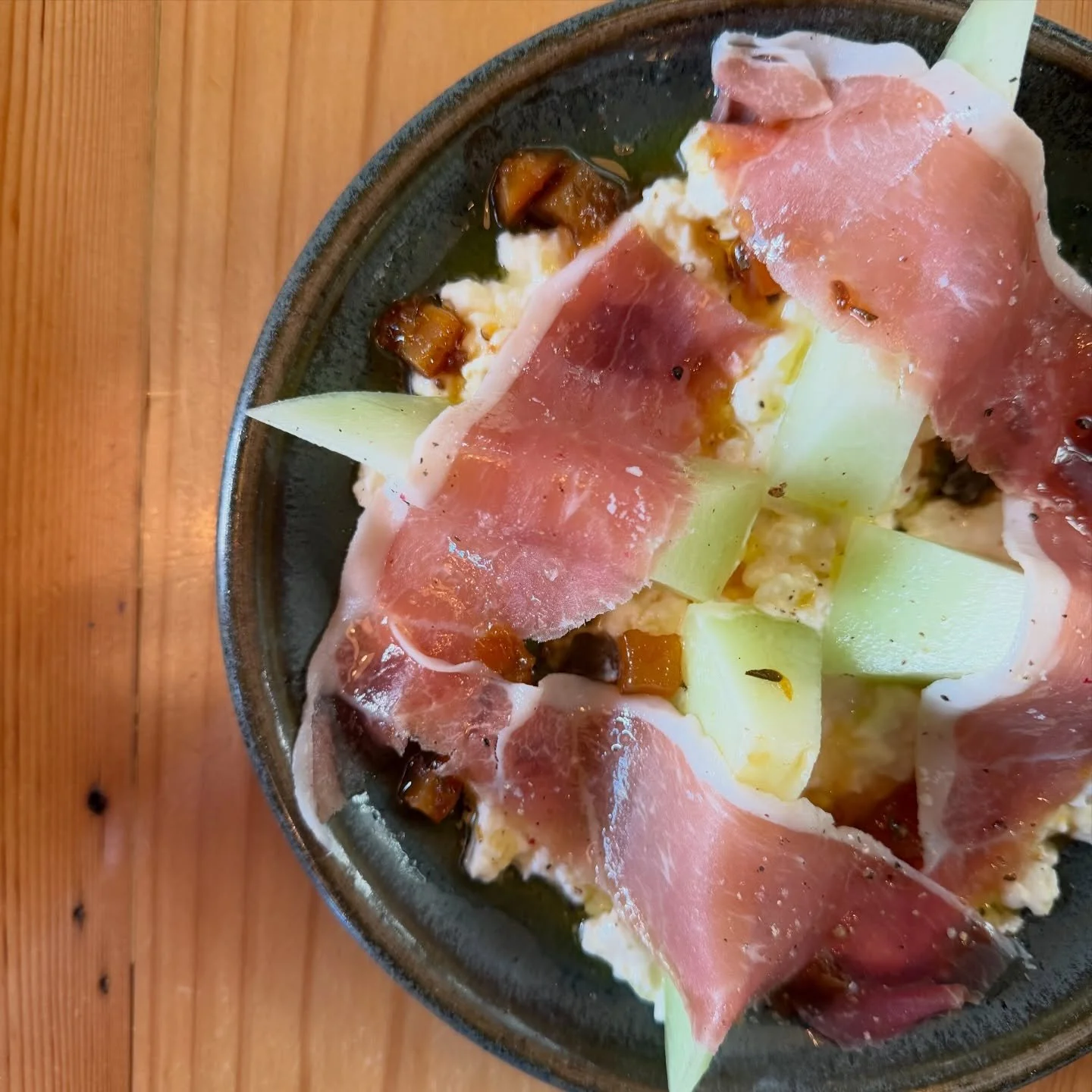 more fine weather snacks at 72 Halifax feat. melon 🍈 pull apart ☀️ 
.
.
sweet honeydew melon 
local prosciutto 
stracciatella 
pear and coriander seed marmalade 
.
.
#summer