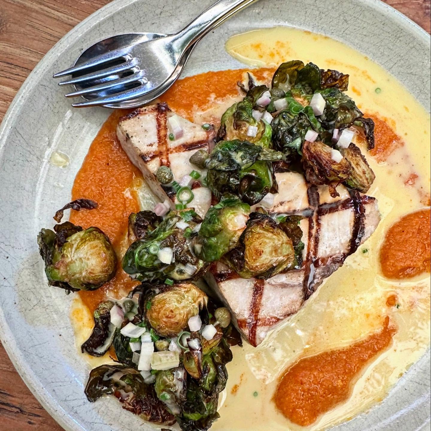 charred swordfish 
.
spicy tomato + ginger 
fried salt and vinegar brussels
buerre blanc