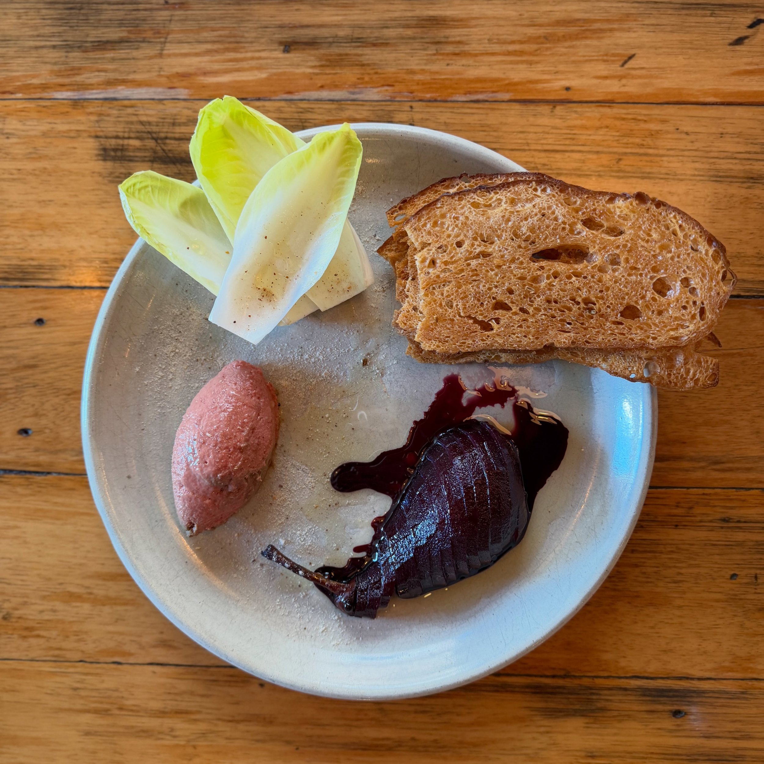 for winter ❄️ 
.
.
free range chicken liver parfait 
shiraz poached pears 🍐 
witlof + fennel crostini 
prickly ash 
.
.
now coming off the pass @herringbone.adl