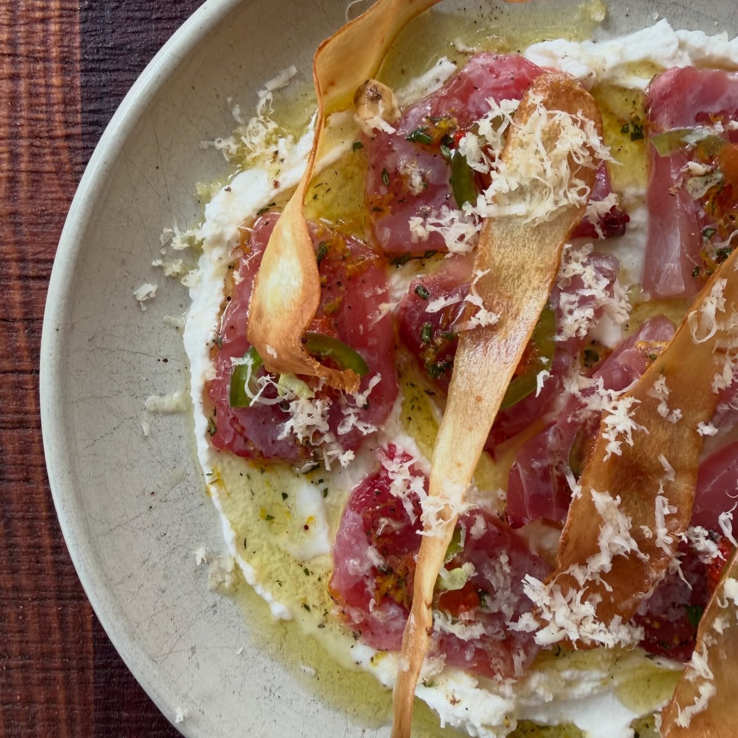 Into autumn 🍂 
.
raw yellowfin tuna 🍣 
roasted salty jalape&ntilde;o 
goat curd 
fried parsnip 
orange and thyme oil 
langhorne creek horseradish 
.
.
#autumn
