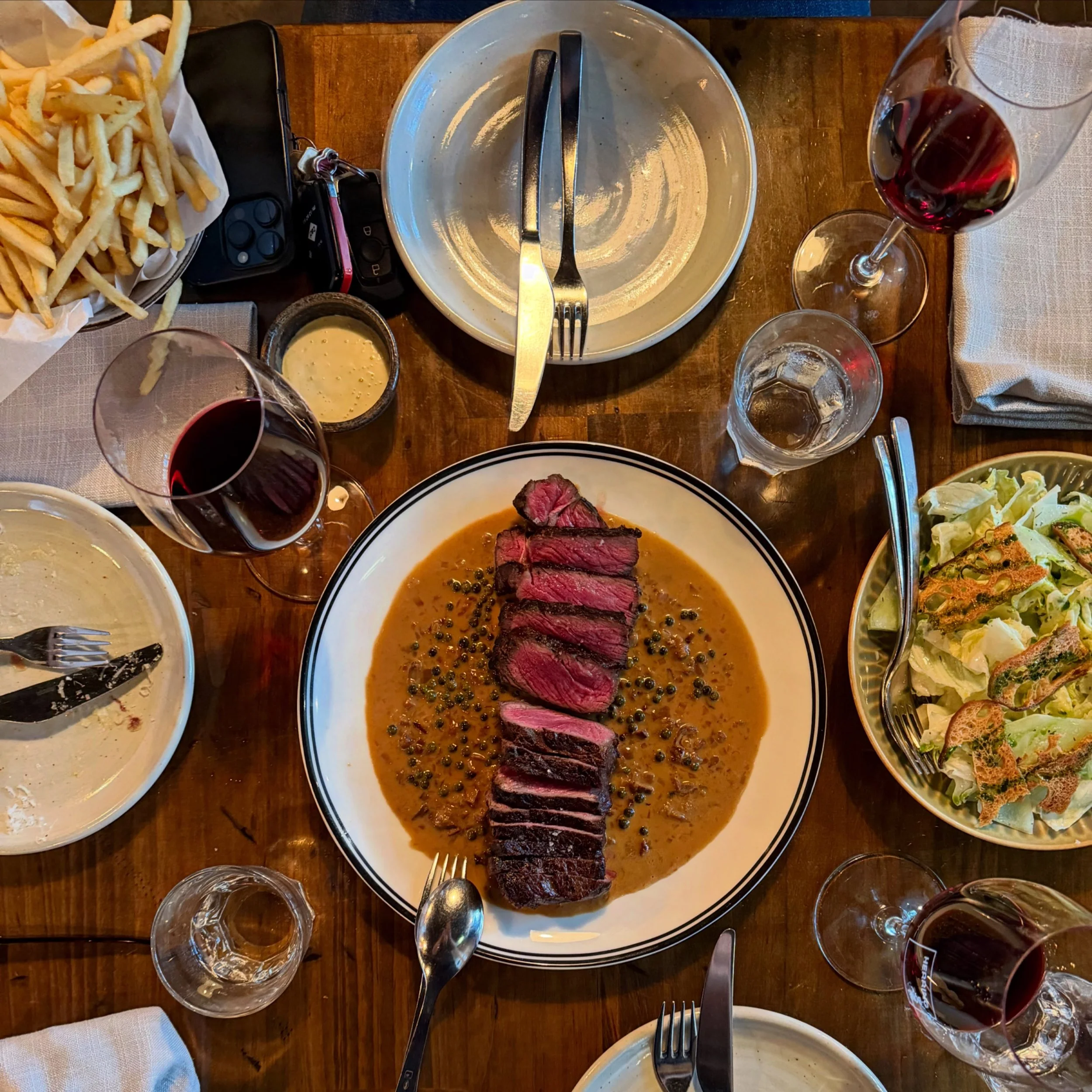 You asked !! We listened 🥩 
.
.
grilled black angus steak frites with porcini sauce au poivre 
.
.
now on the menu @herringbone.adl