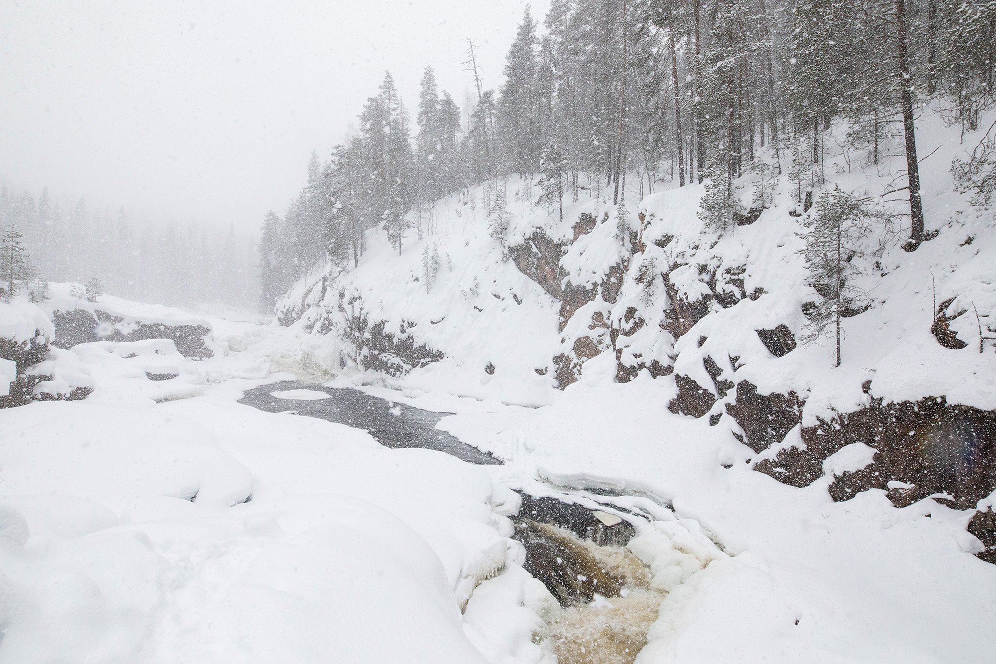 Heavy snowfall by river Oulankajoki