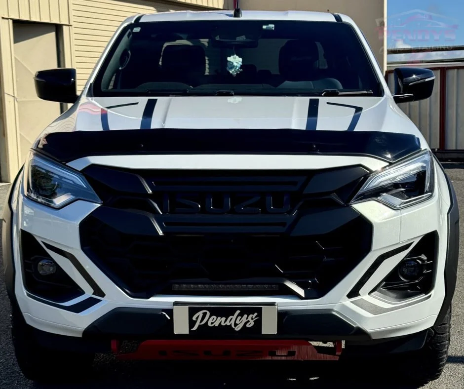 Front view of a white Isuzu with black bonnet accents.