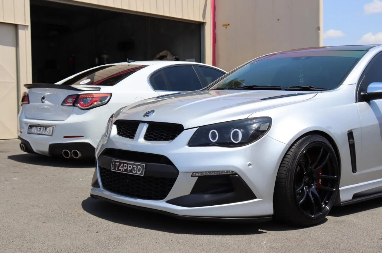 Two detailed performance vehicles outside the Pendys Auto Detailing workshop