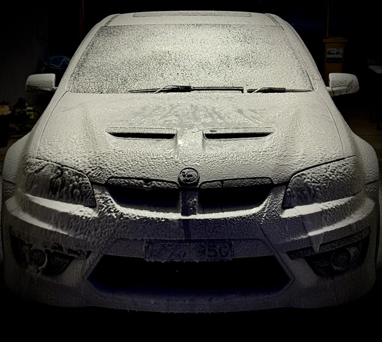 Vehicle covered in snow foam during careful preparation at Pendys Auto Detailing