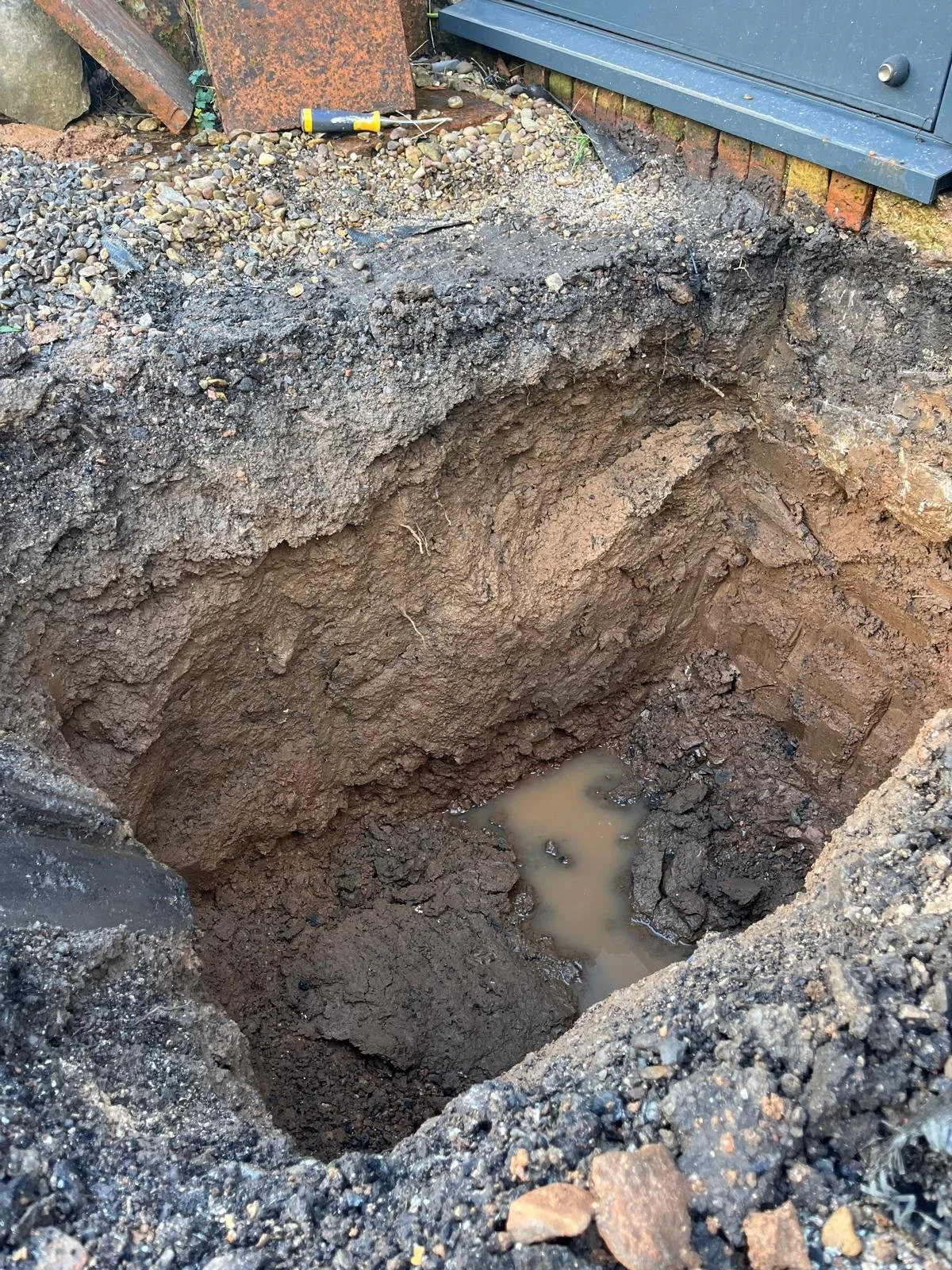 Hand dug trial pit
