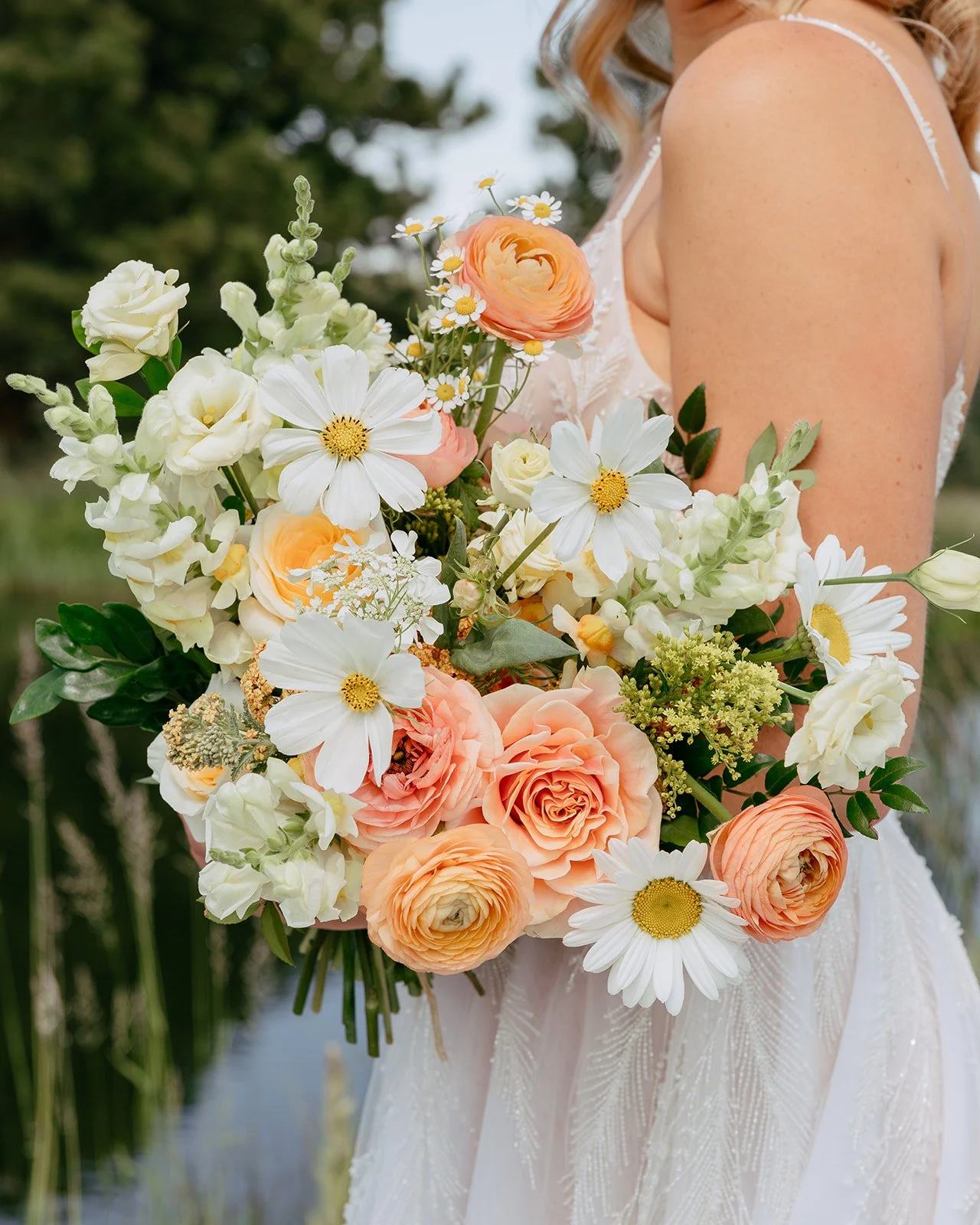 Peach bridal bouquet with cosmos and daisies