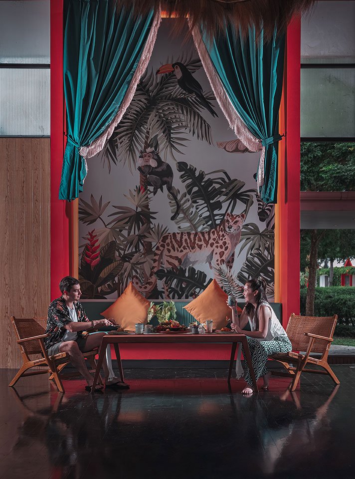 A man and a woman enjoying a meal together at Koa Dining, Tolani Koh Samui, with a scenic restaurant setting.