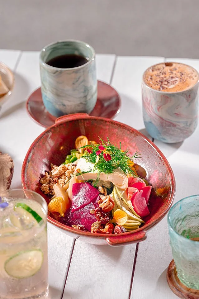 A beautifully decorated bowl of quinoa fruit salad, bursting with fresh flavors, served at Koa Dining, Tolani Koh Samui.