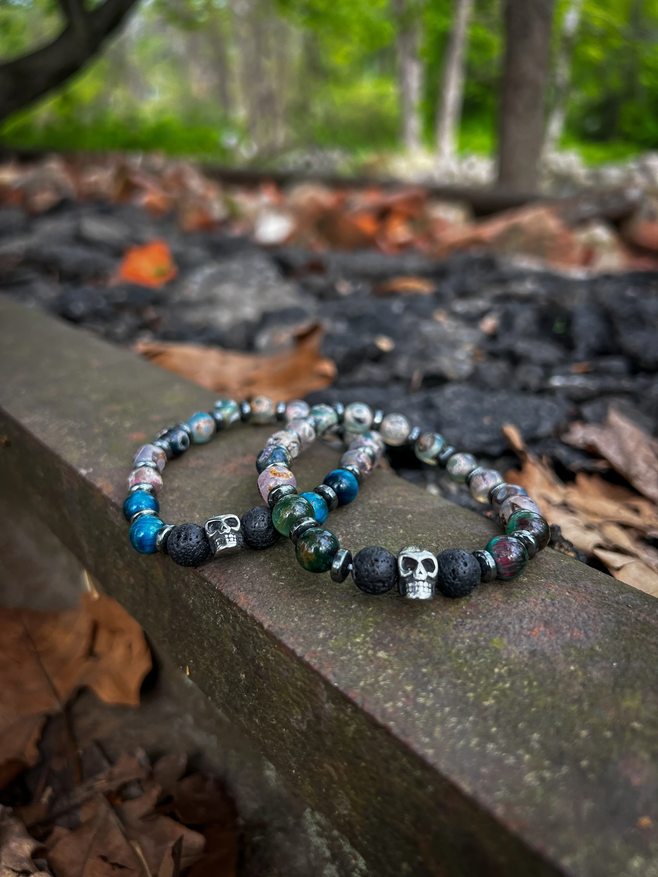 Mala-for-Vets-dzi-lava-hematite-tiger-eye-skulls-rail-newlin-grist-mill.webp