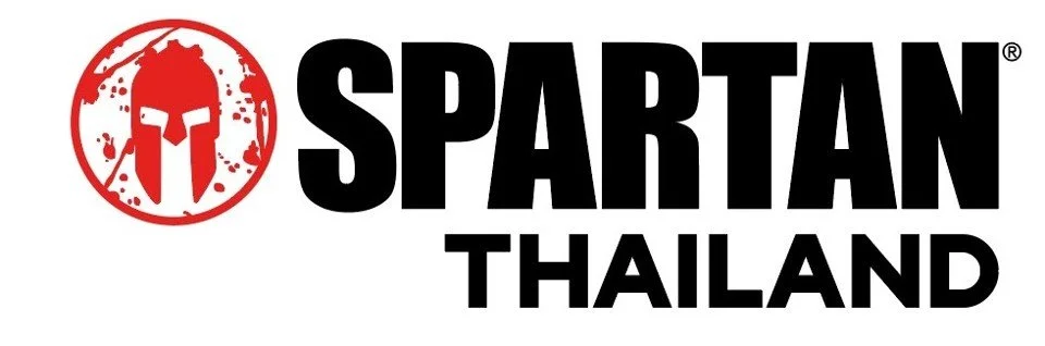 Logo of Spartan Thailand featuring a red Spartan helmet symbol and the text 'SPARTAN THAILAND' in bold black letters.