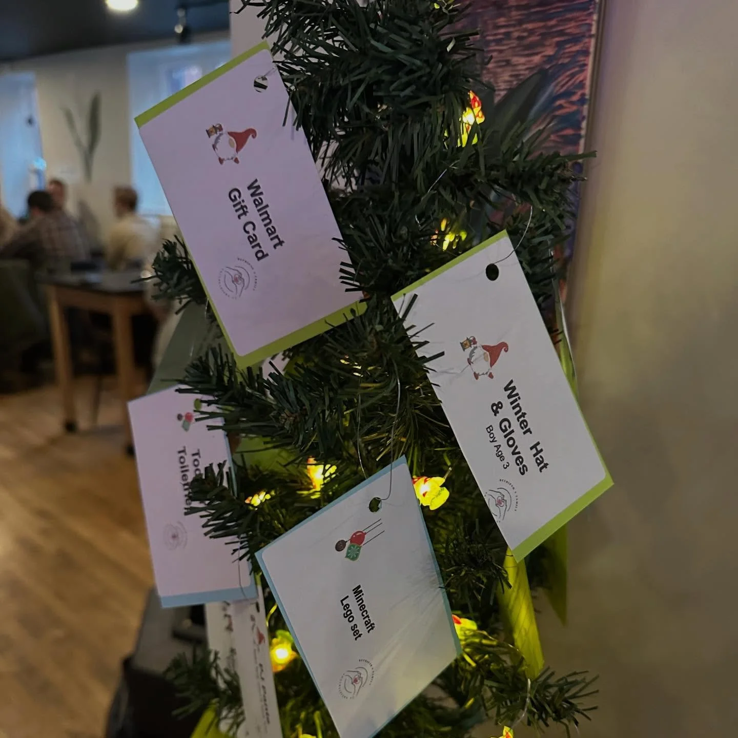 It's that time of year again. Our giving tree is back!
.
Next time you pay us a visit, please consider earning 10% off your entire bar tab by taking a tag from the tree and coming back with the listed gift  donation. These items are specifically aske