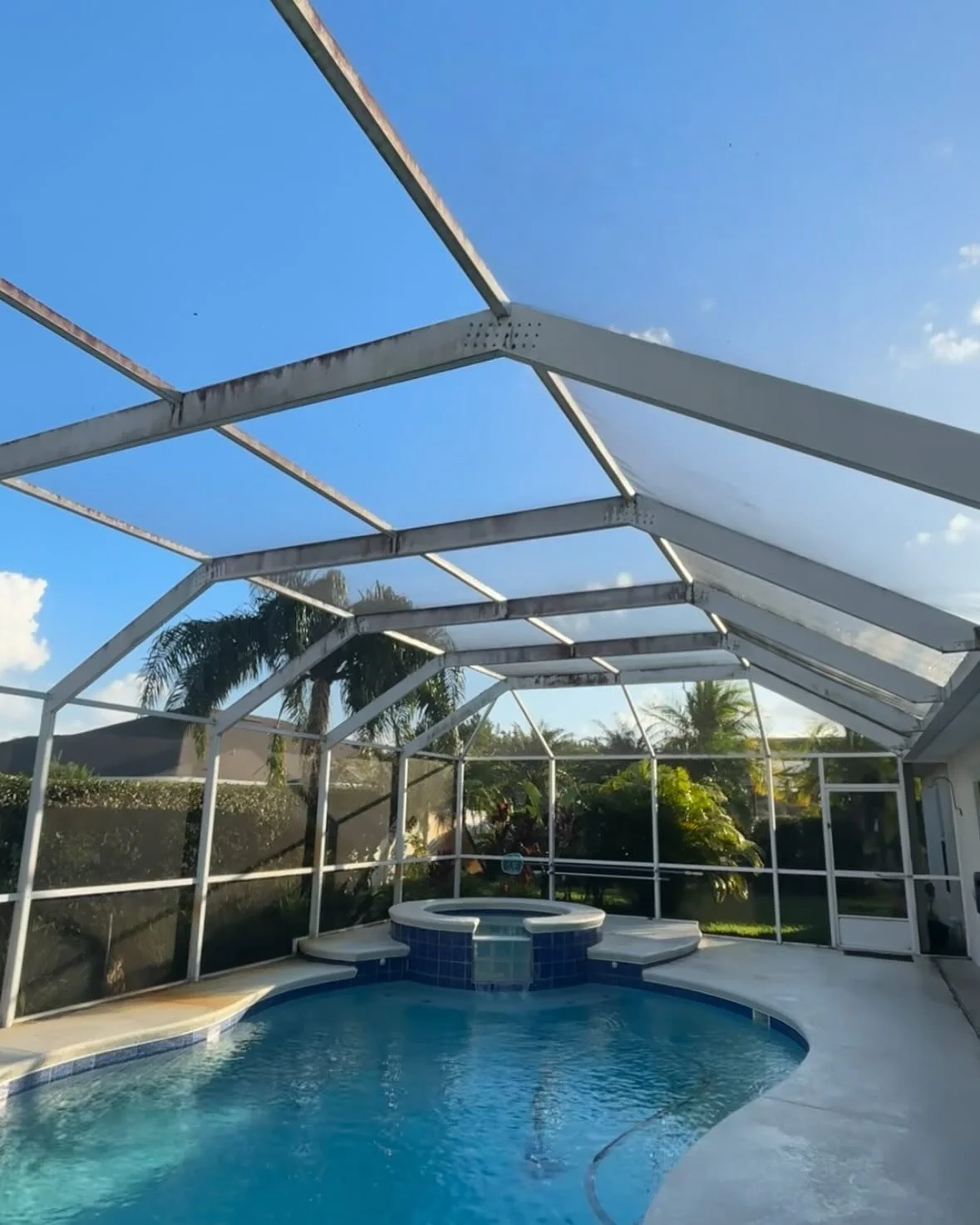 Before and after, was a pleasure refreshing the view of this enclosure and extending its life #poolenclosure #florida #smallbusiness #pressurewashing