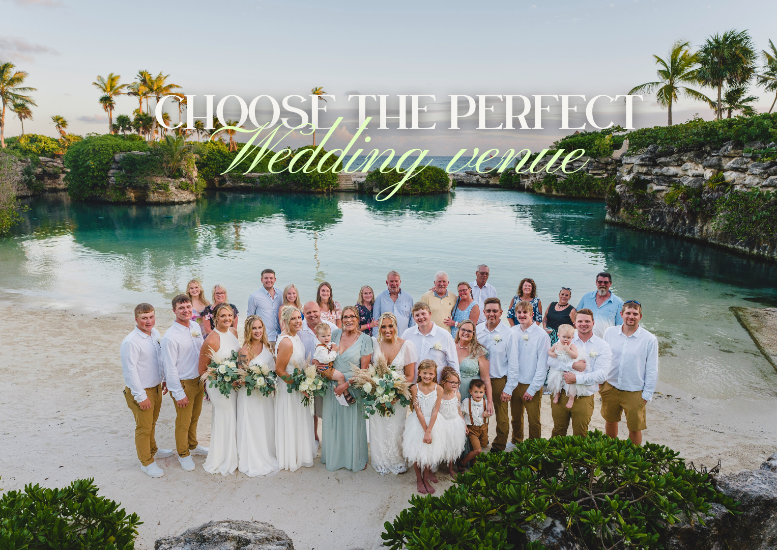 A large wedding group posing on a beach with palm trees, water, and rocky cliffs in the background. Overlaid text reads 'Choose the perfect wedding venue'.