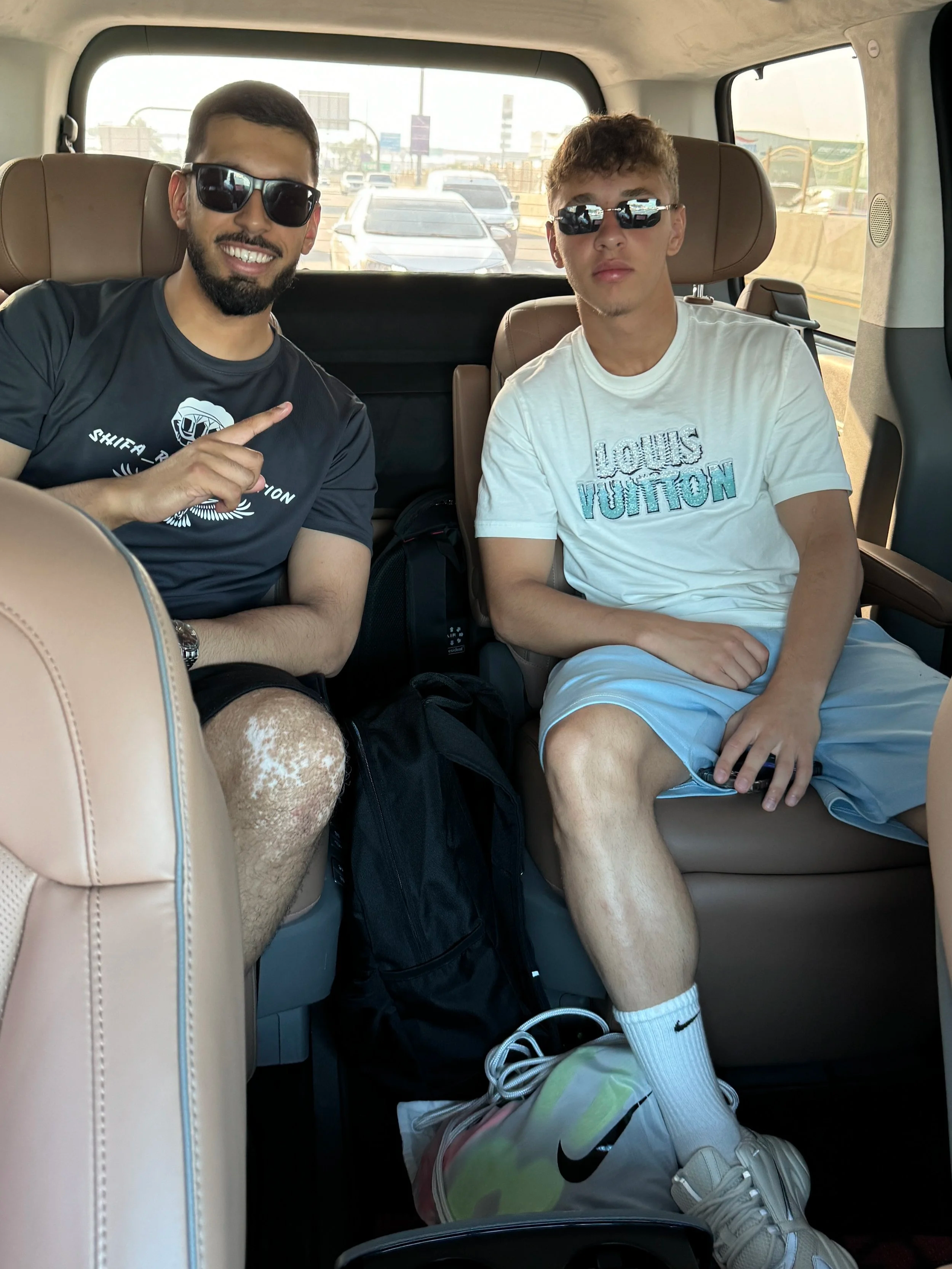 This is an image of Shifa rehabilitation founder Bilal Shaikh with his client the Manchester United youth player Amir Ibragimov