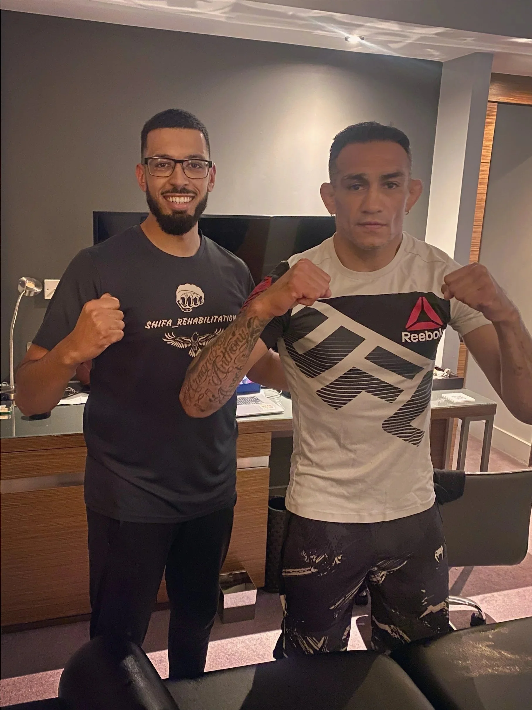 Shifa rehabilitation founder Bilal Shaikh is stood next to former UFC interim champion Tony Ferguson, an American professional mixed martial artist and professional boxer and is the current MFB Middleweight champion.