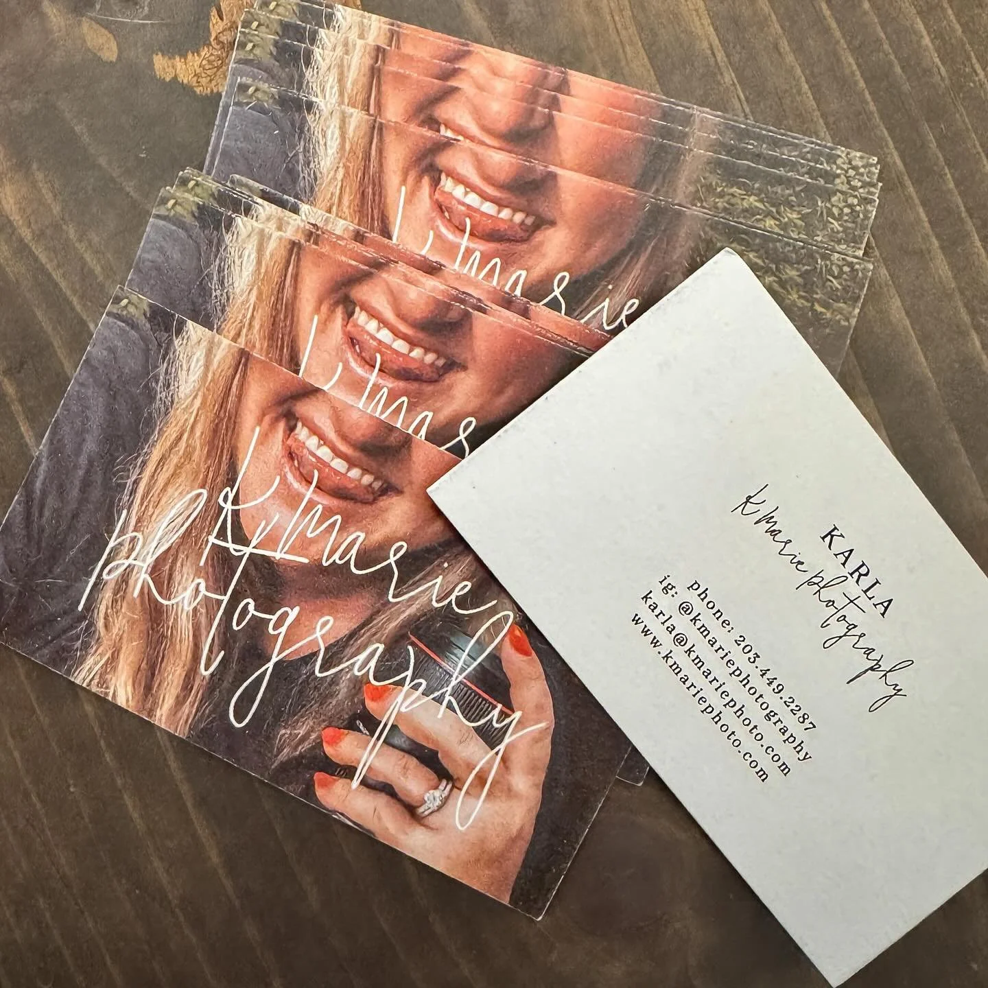 Nothing says &lsquo;please hire me&rsquo; like handing strangers a tiny glossy rectangle of my face smiling like I just saw a dog and a free iced coffee at the same time. 🤪😂 

#kmariephotography #connecticutphotographer #ctphotographer #familyphoto