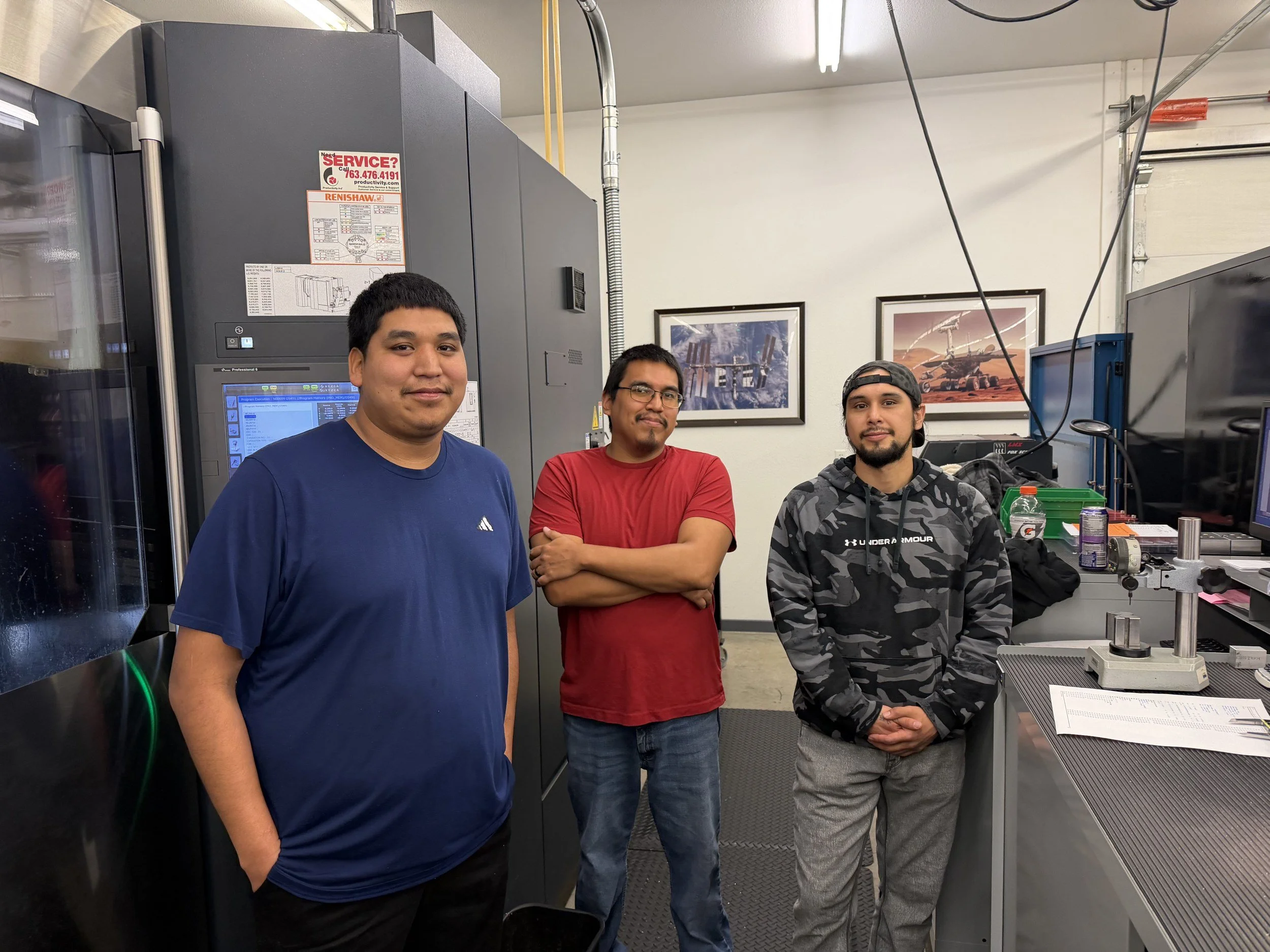 Wells Academy 2026 graduates Seth Sheridan, Jimmy Fineday, and Kohta Martell in the Wells Technology shop