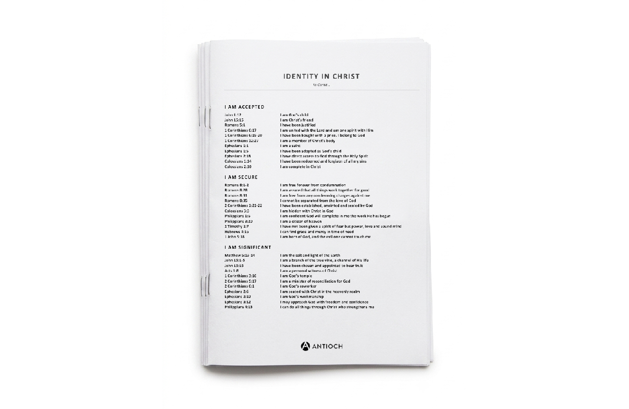 A white book titled "Identity in Christ" published by Antioch, containing sections with biblical affirmations and scriptures.
