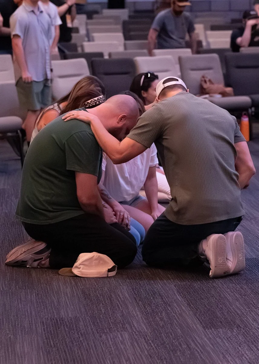 Men praying together at Antioch Community Church in Chandler Dobson Campus