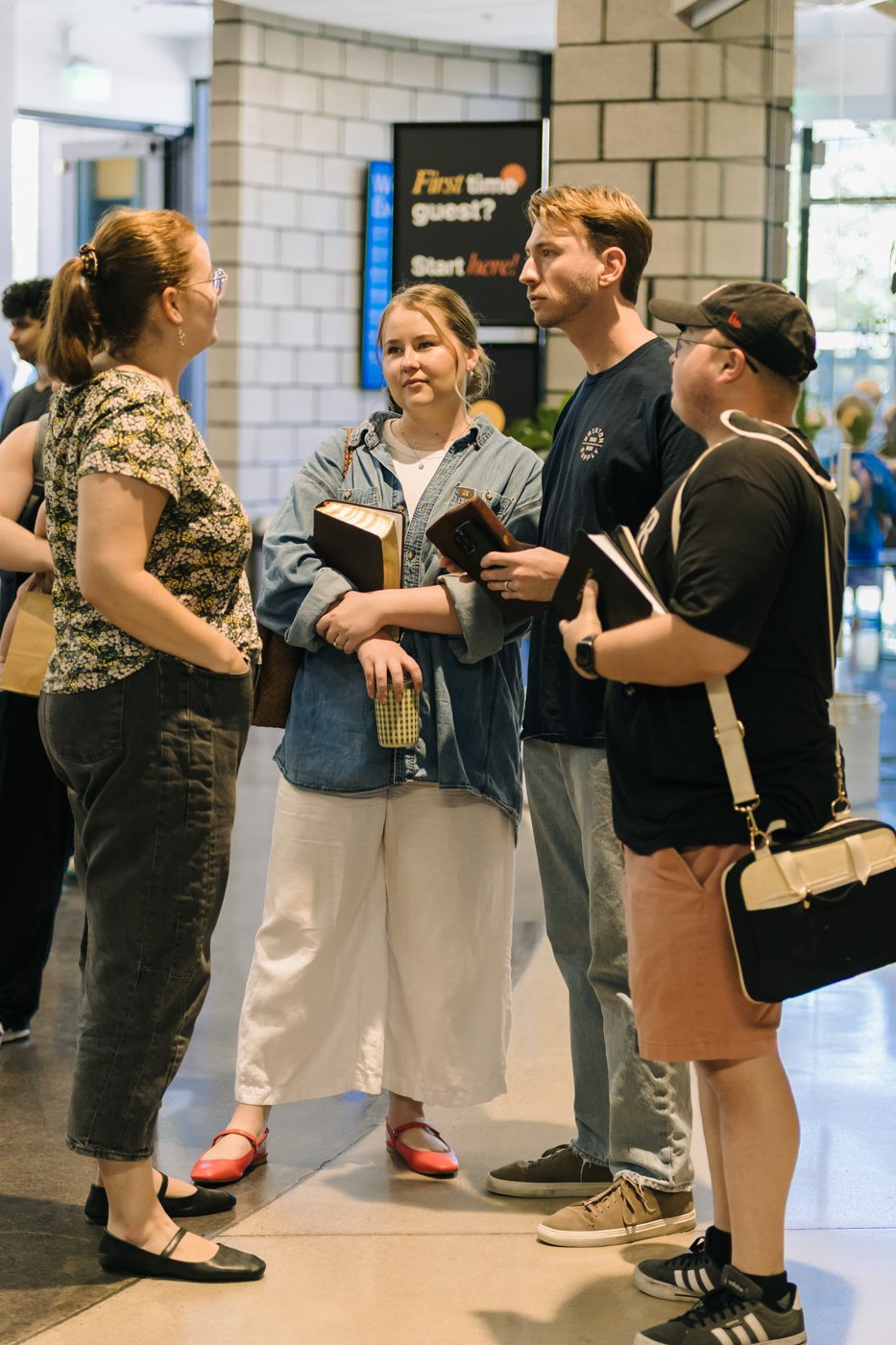 Young adult life group members gathered after a Sunday morning worship service at Antioch Community Church in Chandler
