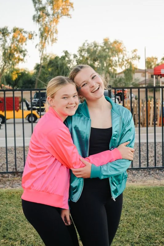 High school girls hugging at an event at Antioch Community Church in Chandler