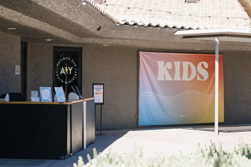 Kids check in Antioch Community Church in Chandler before Sunday service