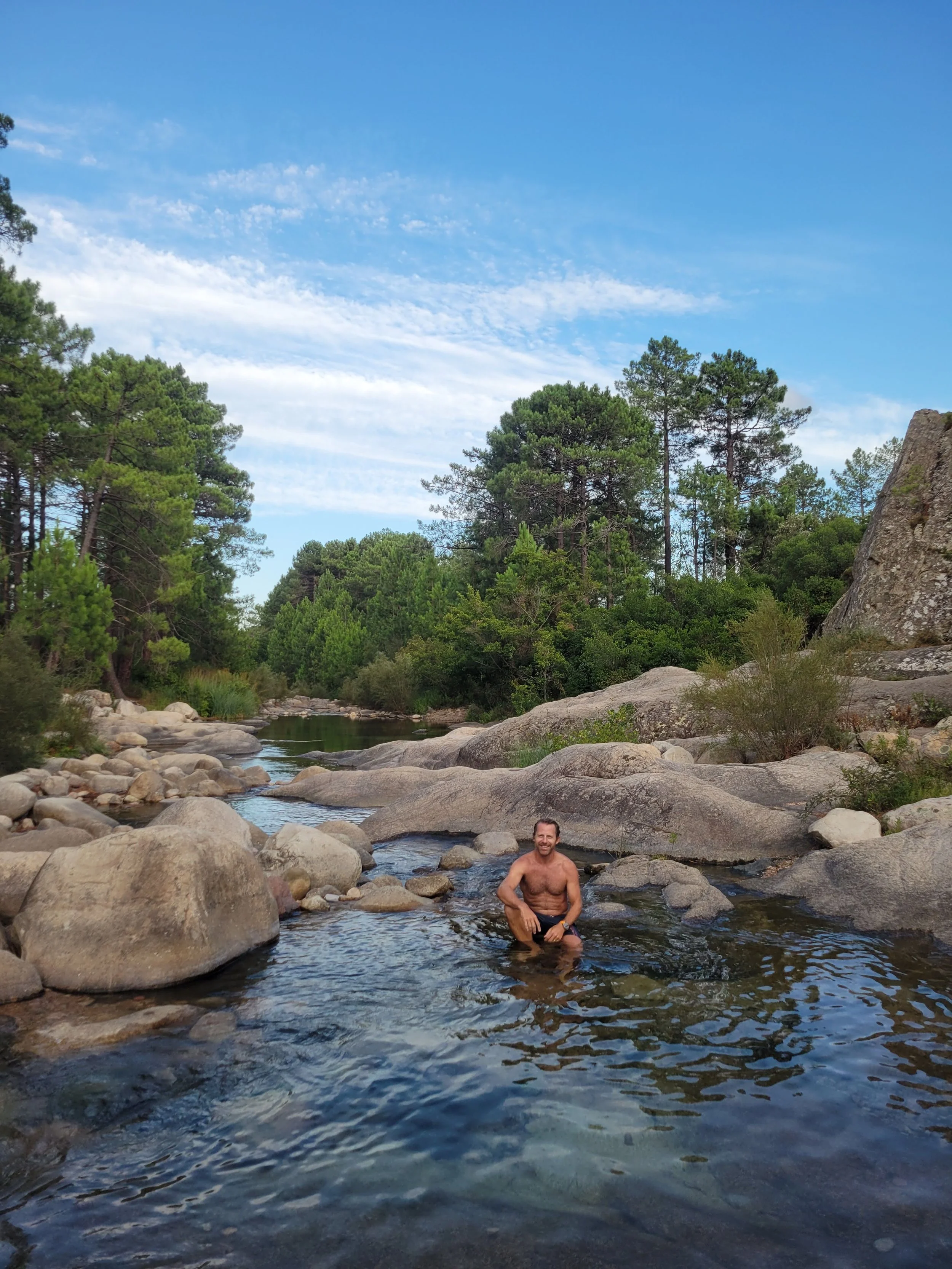 (E) Evening dip in a river in Corsica
