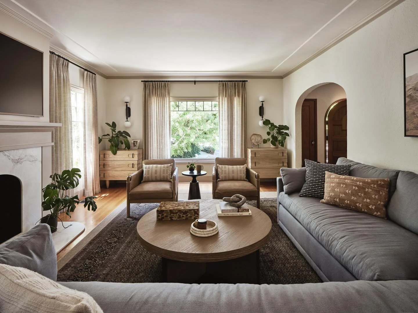 A living room with o p i n i o n s 🤎 

This Oakland Tudor had great bones, but it needed a layout that actually flowed and a fireplace that didn&rsquo;t steal the show for the wrong reasons. We re-worked the architecture, leveled the mantel, and int