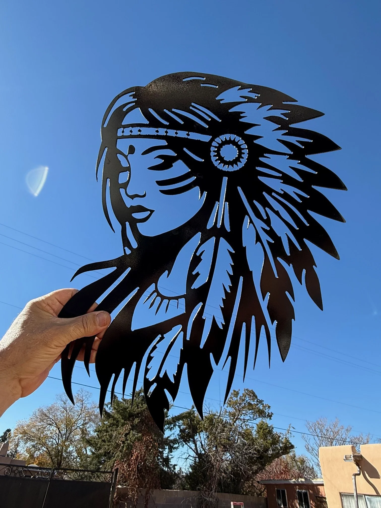 The metal is 16 gauge and the native girl is 18.5 high and 14 wide.