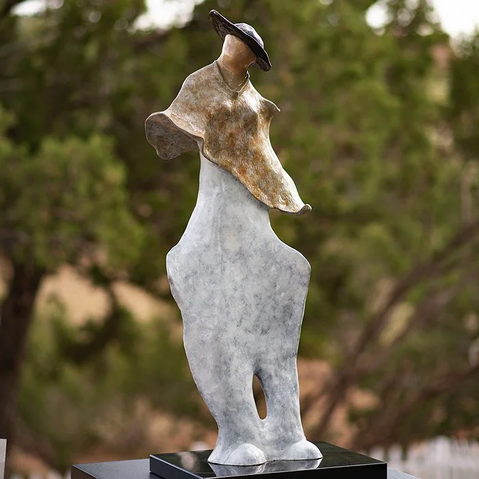 Abstract artwork depicting two spherical shapes with textured surfaces, one light and one dark against a blurred background.