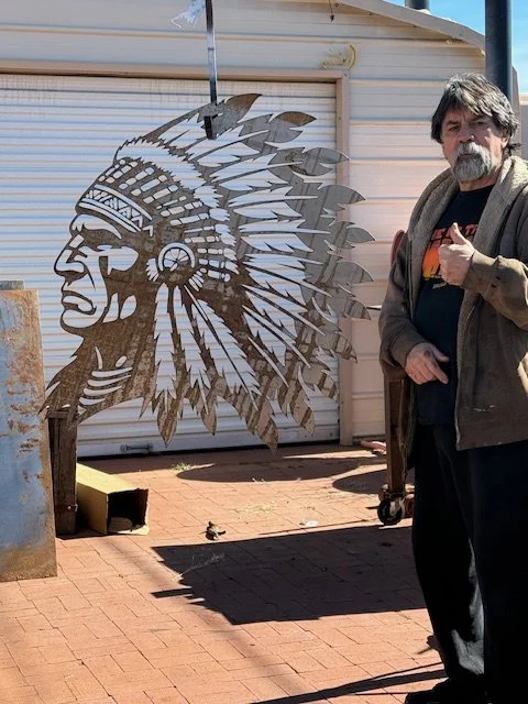 The dimensions on the photos of the native and the dream catcher are each 40 inches tall, just over 3 feet.