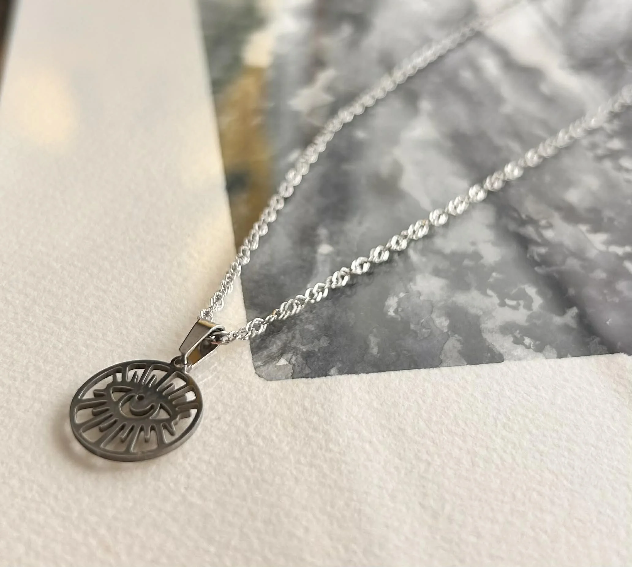 pendentif argent acier inox mauvais oeil 3.jpg