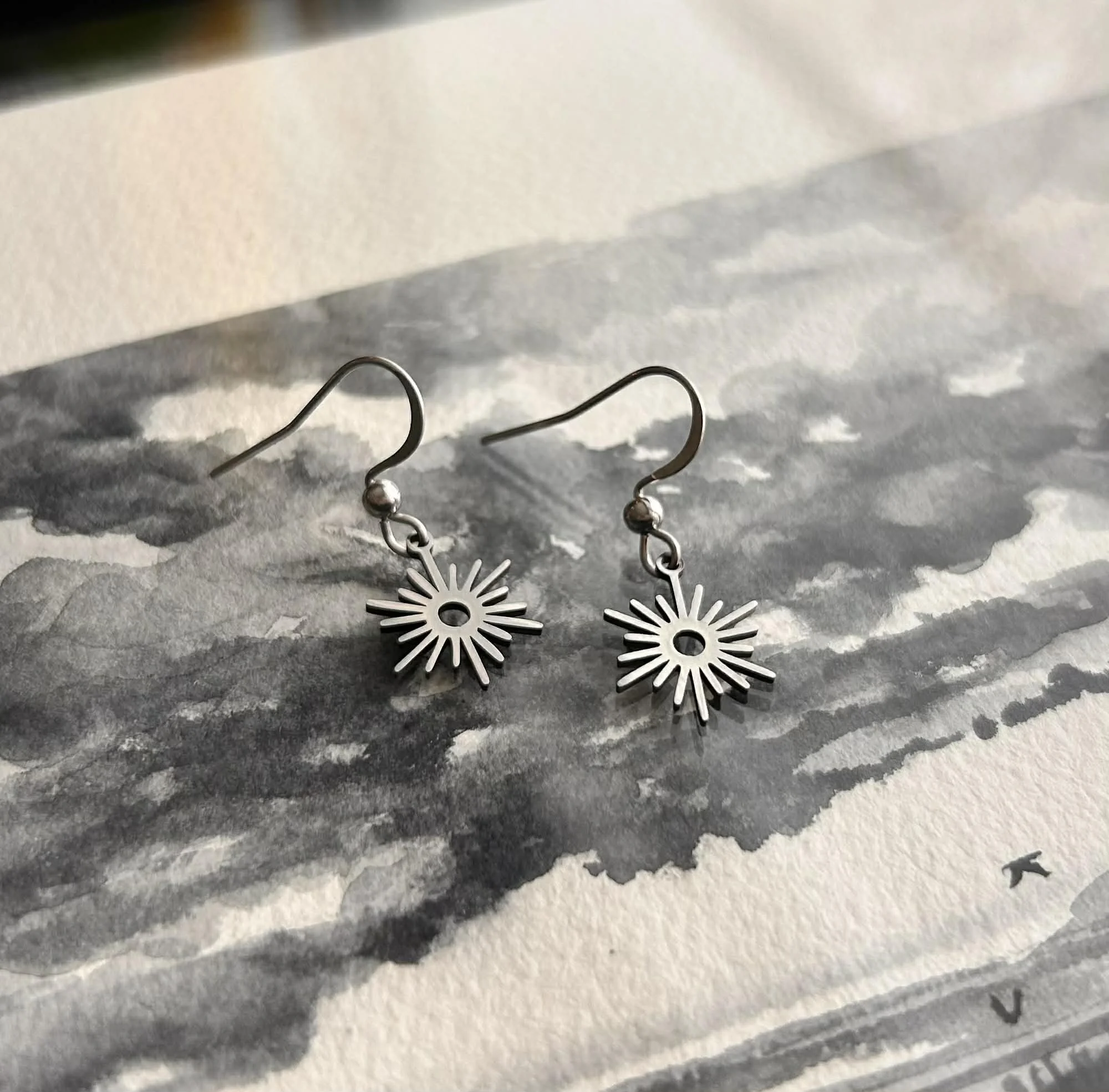 silver earrings tiny sun.jpg