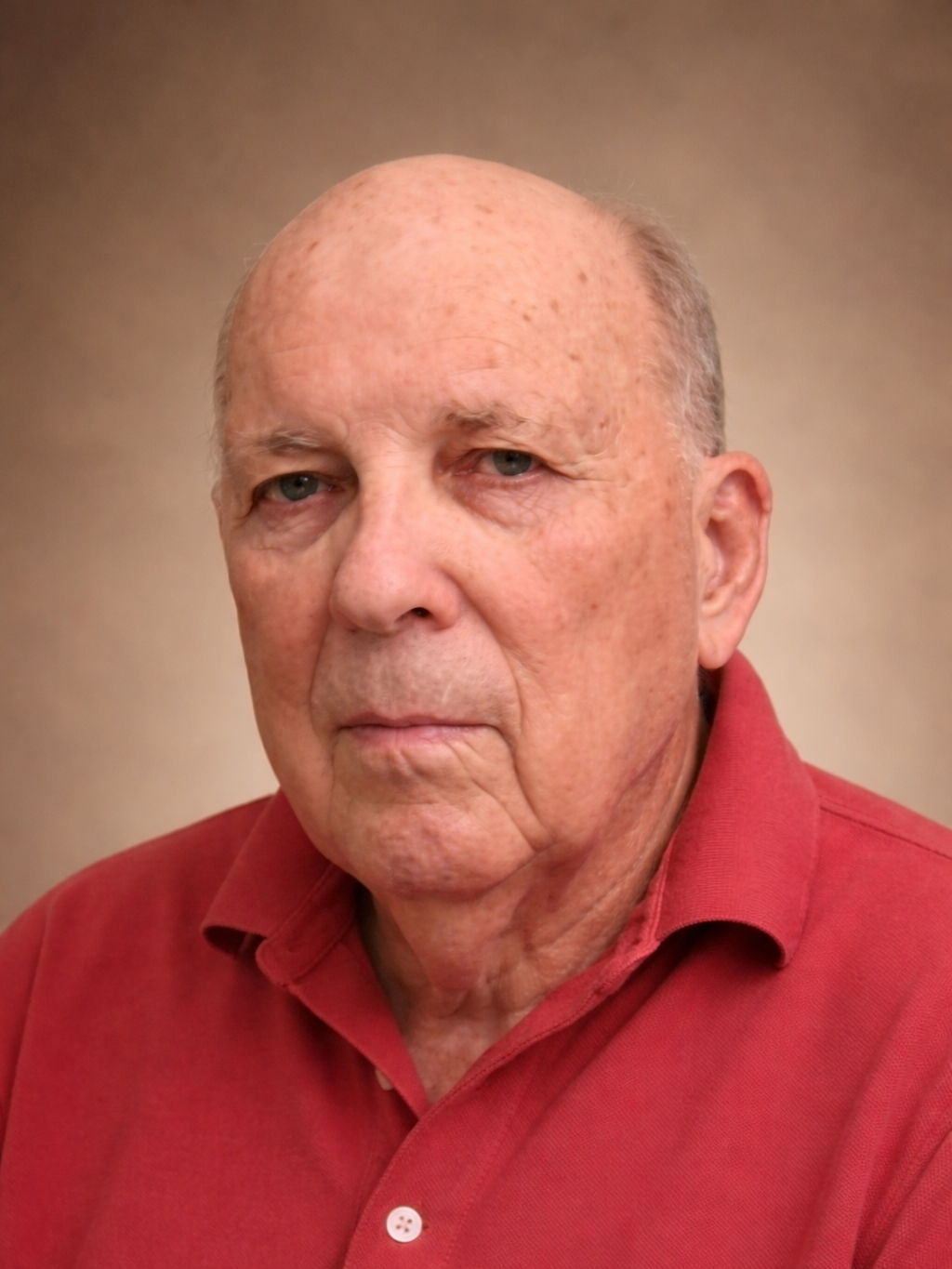 Illustration of a person with short dark hair, wearing a collared shirt and a dark sweater, against a beige background.