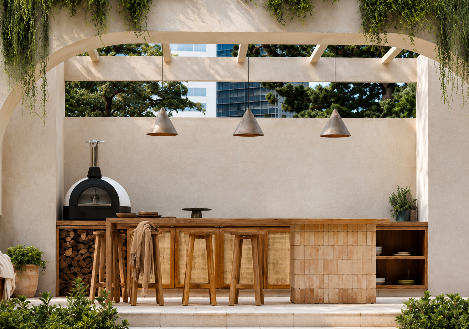 Modern outdoor kitchen with wood cabinetry, pizza oven, bar seating, stucco archway, and Mediterranean-inspired design.
