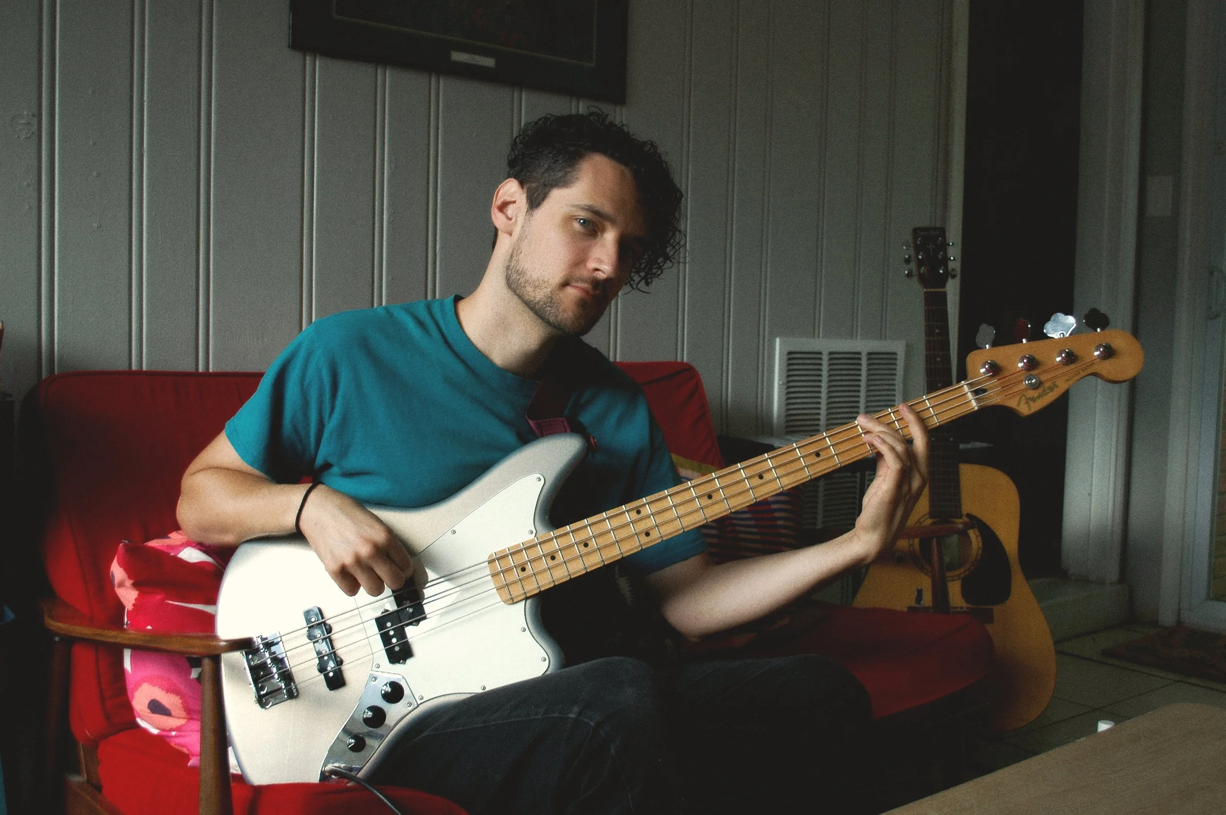 Bass and Bassist teaching a remote music lesson