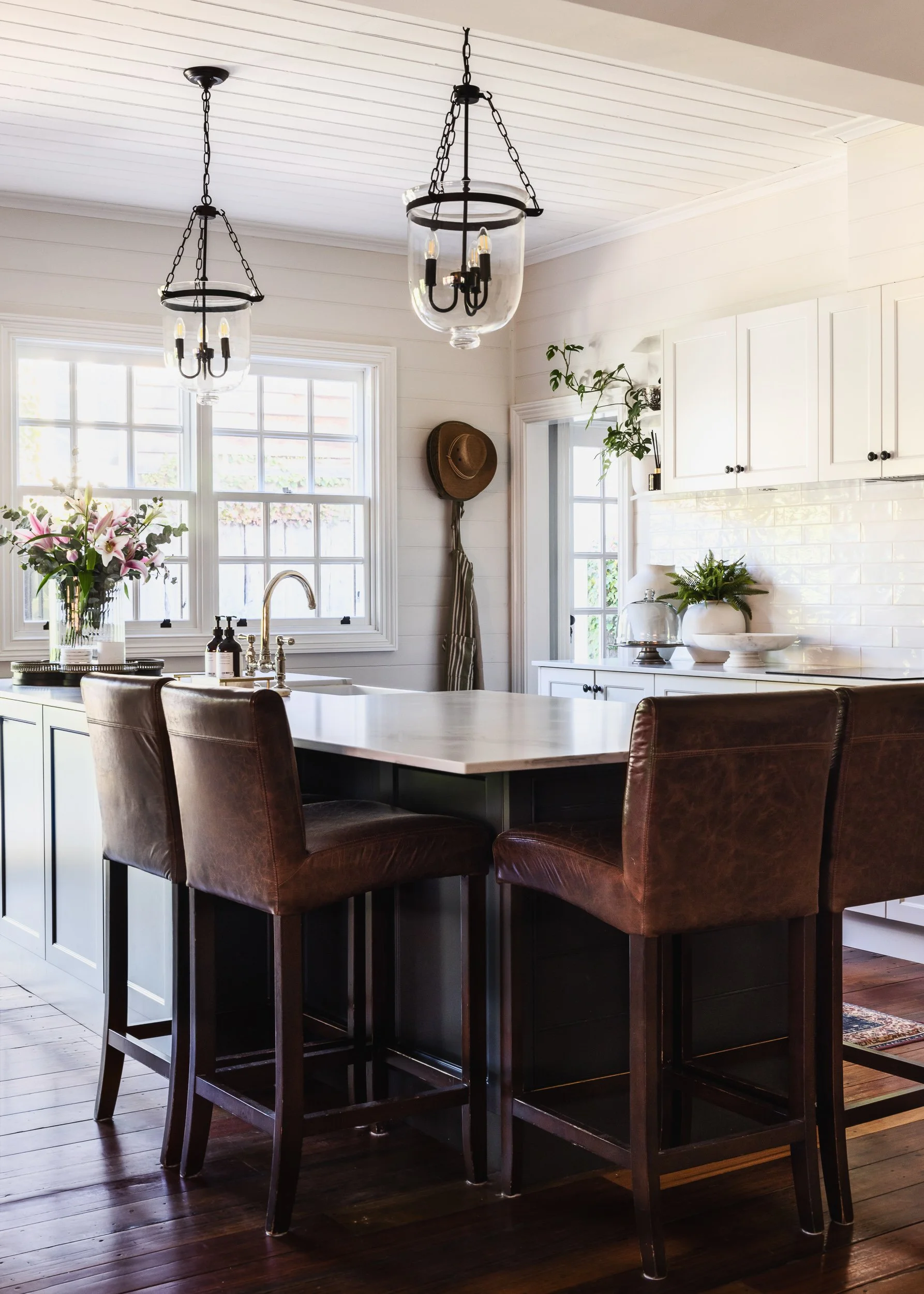 A minimalist farmhouse kitchen with sleek cabinetry and high-end appliances, showcasing Diego Pinto's editorial approach to interior photography in Sydney