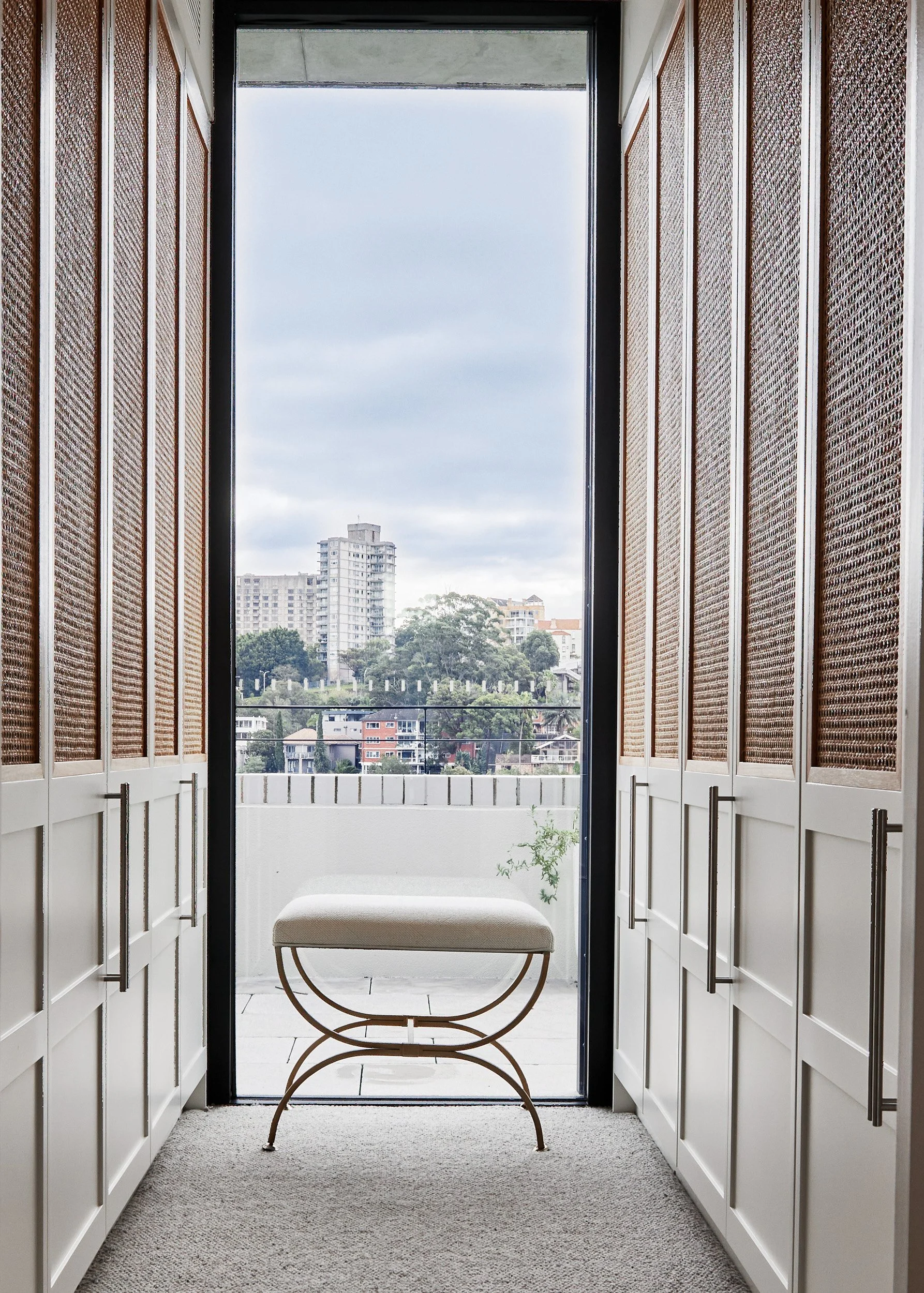 A modern changing room with sleek design elements, captured by interior photographer Diego Pinto in Sydney.